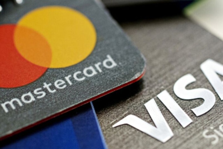 China is putting pressure on Visa and Mastercard to reduce their domestic bank card transaction costs in order to facilitate payments.